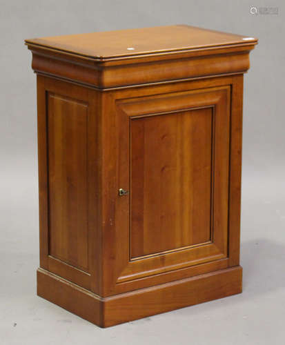 A modern French cherry 'Grange' cabinet with concealed frieze drawer above a cupboard, on a plinth