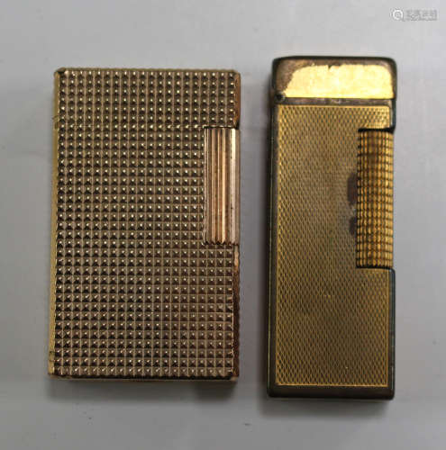 An S.T. Dupont gilt metal rectangular gas lighter with engine turned decoration, together with a