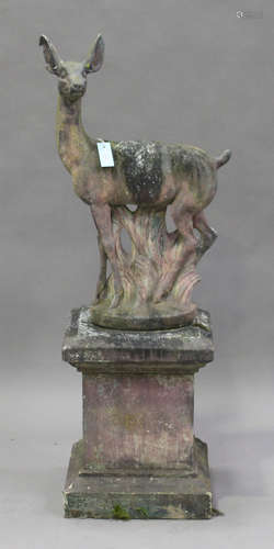 A 20th century cast composition stone garden model of a fawn, raised on a square pedestal, height