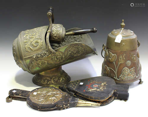 A late Victorian foliate embossed brass helmet coal scuttle and matching shovel, length 41cm,