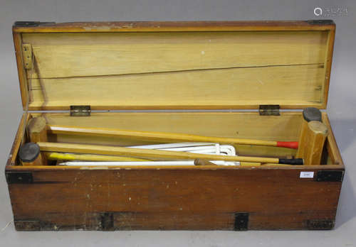 An early/mid-20th century lawn croquet set by F.H. Ayres, London, within its original pine box,