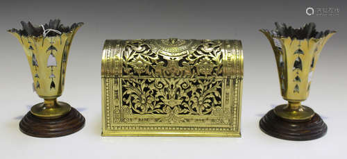 A late Victorian cast brass dome-topped stationery box, the pierced foliate body enclosing a