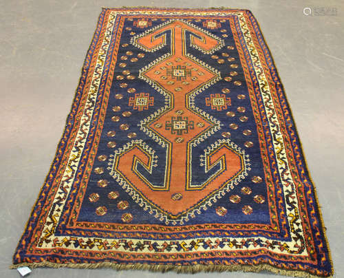 A South Persian kelleh, early 20th century, the midnight blue field with a long arrow-headed pole