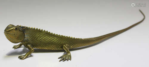 A 20th century cast brass model of a lizard, probably Indian, finely detailed and inset with red