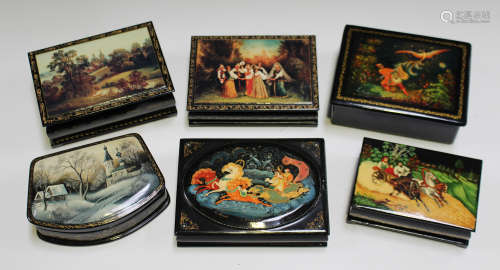 A collection of fourteen late 20th century Russian lacquered papier-mâché boxes, mostly hand painted