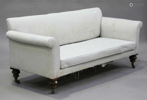 A mid-19th century three-seat settee, upholstered in striped fabric, raised on turned rosewood