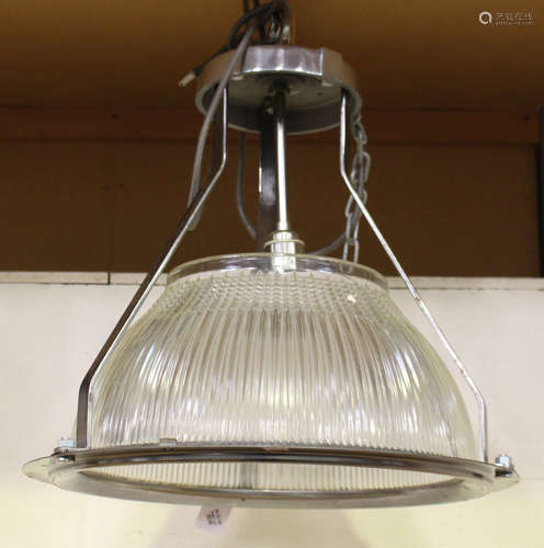 A pair of mid-20th century wrought metal and moulded glass industrial style ceiling lights, height