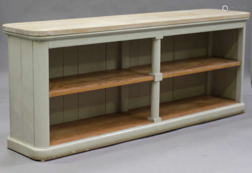 A modern green painted oak kitchen cabinet, fitted with open shelves, on a plinth base, height 92cm,