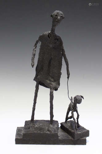 A modern bronze-effect fibreglass figure, in the manner of Alberto Giacometti, modelled as a