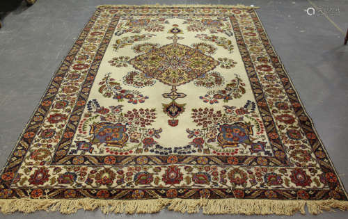 A Tabriz carpet, Central Persia, mid-20th century, the ivory field with a large lozenge medallion,