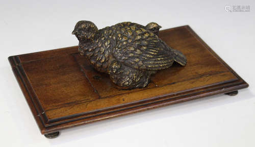 A late 19th century Austrian cold painted cast bronze desk tidy in the form of a bird and its two