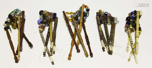 A collection of 19th century and later lacework bobbins, including four turned bone examples and