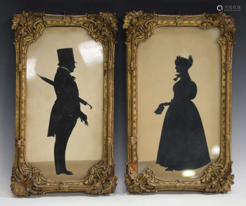A pair of Victorian cut-paper full-length silhouettes, depicting Benjamin and Catherine Smith,