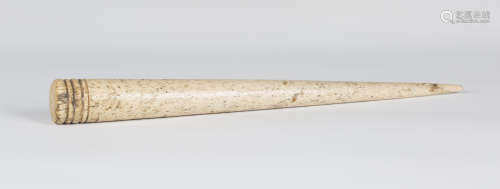 A 19th century whalebone sailor's rope-splicing fid of typical tapering form with ring turned end,