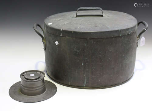 A late 19th/early 20th century patinated copper oval pan and cover, the sides with applied loop