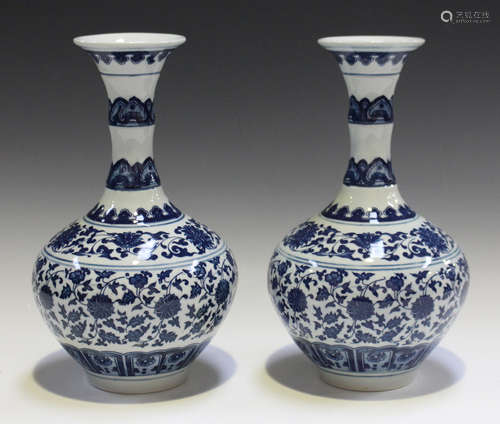 A pair of modern Chinese blue and white porcelain vases, the waisted necks and bulbous bodies