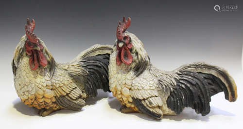 A pair of early/mid-20th century moulded composition models of seated chickens, length 39cm.Buyer’