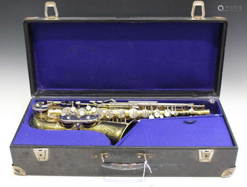 A mid-20th century German brass alto saxophone, the bell detailed 'Champion B & M, Made in GDR',