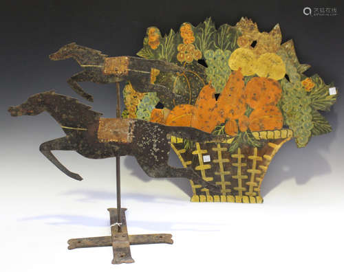 A sheet iron weather vane in the form of two race horses, mounted on an 'X' frame base, height 46cm,