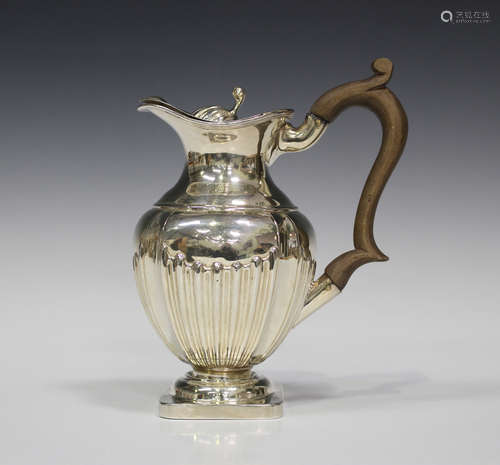 A late Victorian silver hot water pot of half-reeded form, Chester 1897 by George Nathan & Ridley