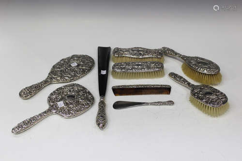 A group of silver and plated dressing table accessories, including a late Victorian hand mirror,