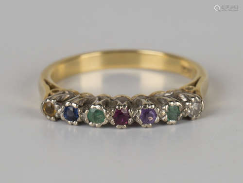 A gold and gemstone set ring, the gemstones mounted to spell 'Dearest', detailed '18ct', ring size