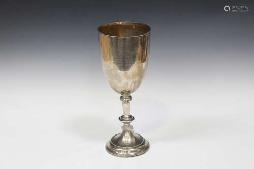 A large late Victorian silver goblet, the U-shaped body presentation inscribed above a beaded knop