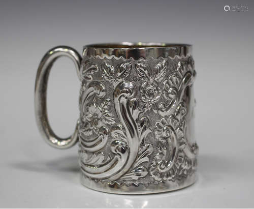 A late Victorian silver christening cup, gilt lined and with embossed floral and scroll