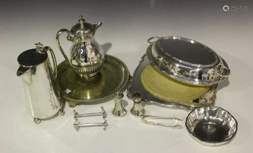 A small group of silver and plated items, including a pair of George V silver sugar tongs,