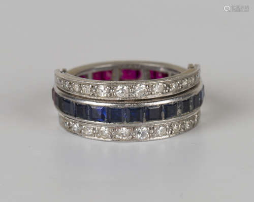 A diamond, synthetic ruby and synthetic sapphire swing-over eternity ring, mounted with circular cut