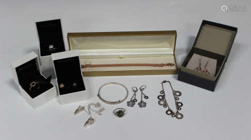 A group of mostly silver jewellery, comprising three Pandora charms, two Pandora rings, with three
