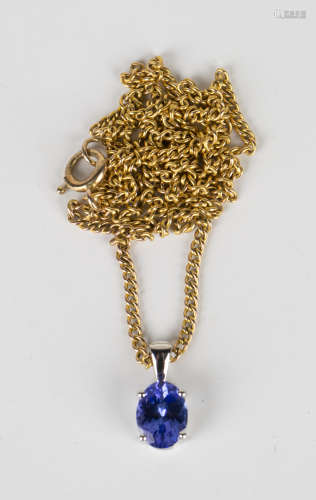 A platinum and tanzanite single stone pendant, length 1.2cm, with a gold neckchain on a boltring