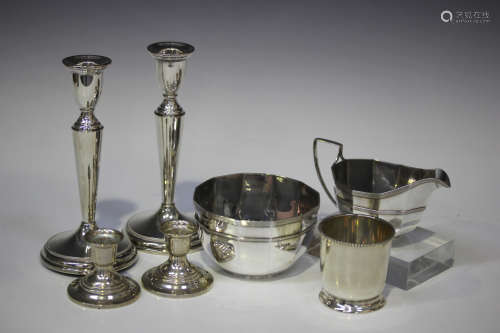 A small group of silver items, including an Edwardian sugar bowl and milk jug with reeded rims,