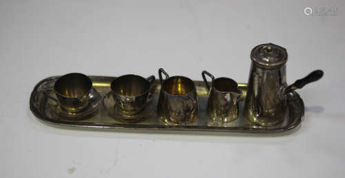 An Edwardian silver toy six-piece hot chocolate set, comprising chocolate pot, twin-handled sugar