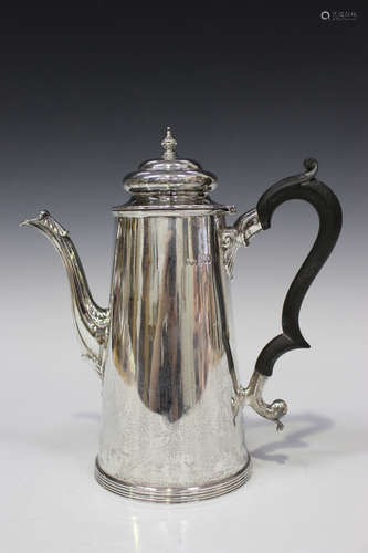 A late Victorian silver coffee pot of tapered cylindrical form with domed hinged lid and scroll