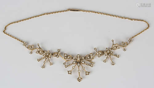 A gold and half-pearl pendant necklace, the front formed as graduated floral and foliate scroll