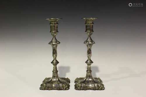 A pair of George V silver baluster candlesticks, each cylindrical sconce with detachable nozzle,