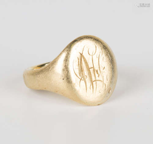 A gold oval signet ring, monogram engraved, detailed '18', ring size approx O1/2.Buyer’s Premium