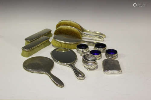 A group of silver items, including a pair of George III circular salts, raised on hoof feet,