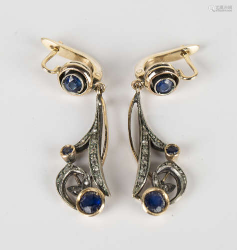 A pair of gold, silver, rose cut diamond and sapphire pendant earrings, each in an openwork