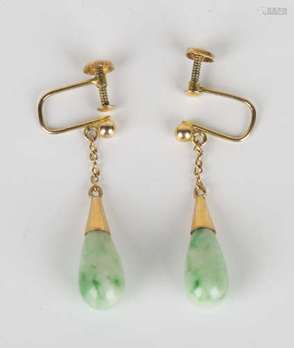 A pair of gold and jade pendant earrings, each mounted with a drop shaped jade, with screw fittings,