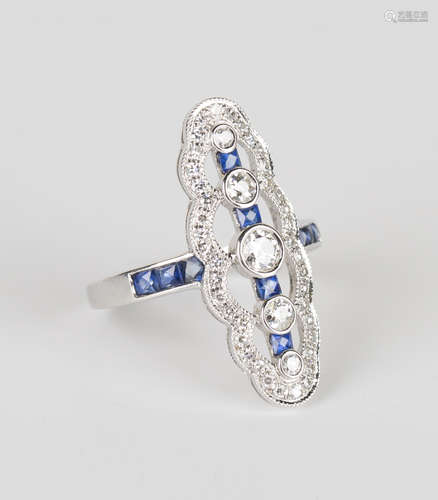 A white gold, diamond and sapphire ring, collet set with a row of five graduated circular cut