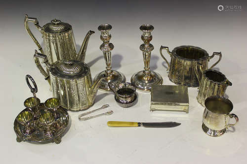 A collection of plated items, including a four-piece tea set, a four-egg cruet stand and egg cups, a