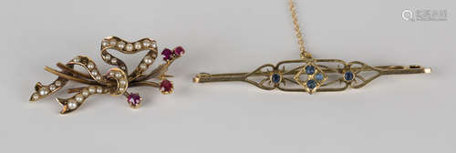 A gold, seed pearl and ruby brooch, designed as a stylized ribbon bow, detailed '15ct', width 3.5cm,