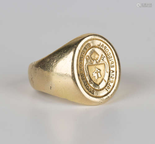 A gold seal ring with an ecclesiastical crest within a Latin motto, ring size approx U.Buyer’s