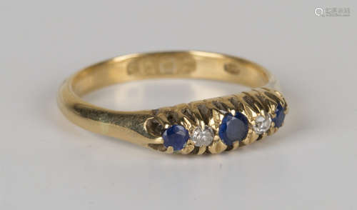 An 18ct gold, sapphire and diamond five stone ring, mounted with three circular cut sapphires