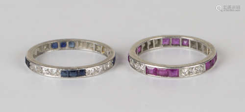 A platinum, ruby and diamond full eternity ring, mounted with rows of circular cut diamonds