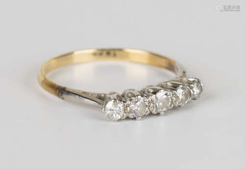 A gold and diamond five stone ring, mounted with a row of circular cut diamonds, detailed '18ct',