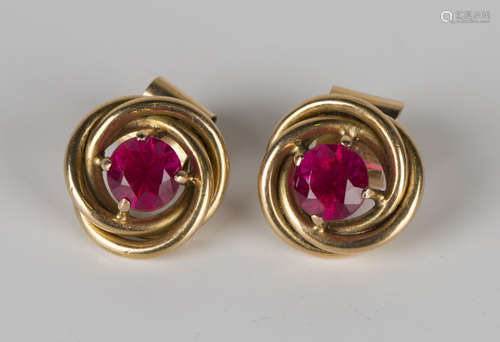 A pair of gold and synthetic ruby single stone earrings, each claw set with a circular cut synthetic