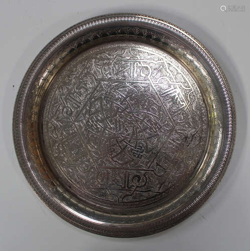 A 20th century Egyptian silver circular dish with engraved decoration, diameter 24.8cm.Buyer’s